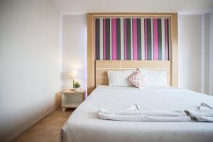 Cama o camas de una habitación en The Greenery Hotel