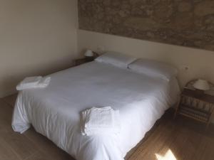 Cama o camas de una habitación en La Casa de Ana en Fisterra