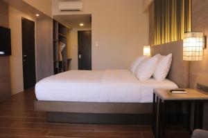 The Aurora Subic Hotel Managed By HII客房内的一张或多张床位