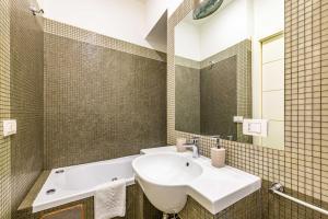 a bathroom with a sink and a bath tub at Luxury Apartments Pantheon Roma in Rome
