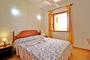 Ένα ή περισσότερα κρεβάτια σε δωμάτιο στο Costa Rei Villette Rei Marina con wi-fi