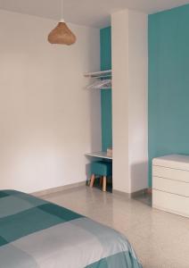 a bedroom with a bed and a desk at B&B Casa Giardino Ferrazzano in Ferrazzano