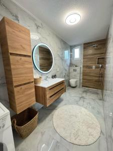 a bathroom with a sink and a mirror at Family estate Hadžalova avlija in Bihać