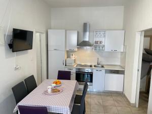 Kuchyň nebo kuchyňský kout v ubytování Apartments Coric + 25 fotografií
