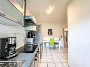 a kitchen with a counter top with a coffee maker at Apartment Ferienapartments Adenau-1 by Interhome in Adenau