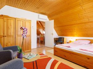 a bedroom with a bed and a wooden ceiling at Holiday Home Emi - BAC110 by Interhome in Badacsonytomaj