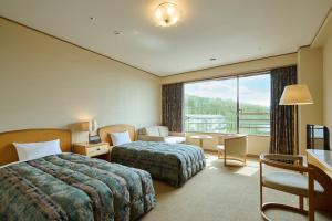 Postel nebo postele na pokoji v ubytování Hotel Laforet Nasu