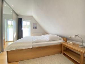 Voodi või voodid majutusasutuse Ferienhaus Ostseekind Karlshagen toas