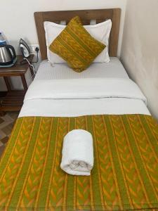 Postel nebo postele na pokoji v ubytování Calangute Beach Crystal