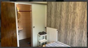 a room with a bathroom with a bed and a door at Sonnberg in Stall