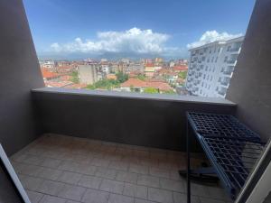 a balcony with a view of a city at Ozzys Place Shkoder in Shkodër