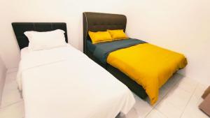 Ένα ή περισσότερα κρεβάτια σε δωμάτιο στο Kulai Tmn Putri Tmn Gunung Pulai Tmn Baiduri Tmn Kota Kulai Tmn Lagenda Kulai 3-5BR near Airport JPO IOI