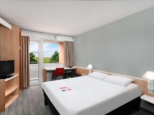 Posteľ alebo postele v izbe v ubytovaní Ibis Budapest Citysouth