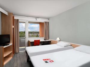 Posteľ alebo postele v izbe v ubytovaní Ibis Budapest Citysouth
