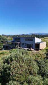 a house on top of a hill in a field at Askop Hilltop Farm House The Crags Plettenberg Bay in The Crags