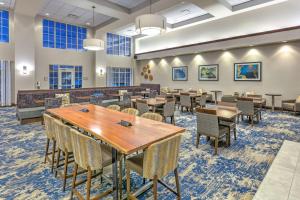 a dining room with tables and chairs at Homewood Suites - Rock Springs in Rock Springs
