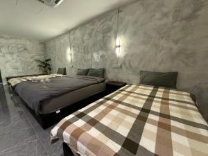 Postel nebo postele na pokoji v ubytování Ipoh Zing Vale - Family & Couple Suite