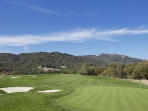a view of a golf course with mountains in the background at Fairmont Sonoma Mission Inn & Spa in Sonoma