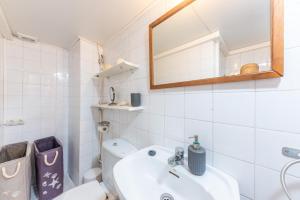 a bathroom with a sink and a toilet and a mirror at Cas Padrins -Portopetro- in Portopetro +18 photos