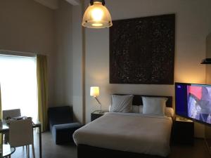 A bed or beds in a room at B&B Wellness Yoake