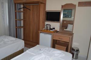 Postel nebo postele na pokoji v ubytování Dilhan Hotel