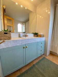 a large bathroom with a sink and a mirror at Sagaró sea housegardenbarbacue8 paxsea view in Sant Feliu de Guixols