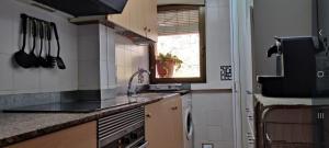 Kuchyň nebo kuchyňský kout v ubytování Apartamento Casalmar