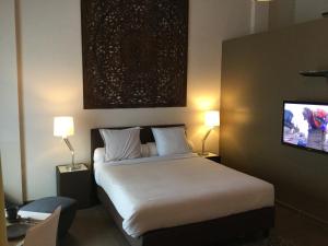 A bed or beds in a room at B&B Wellness Yoake