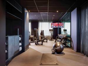 a room with a gym with a pilates ball on the floor at TRIBE Milano Malpensa in Vizzola Ticino