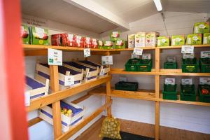 a store room with shelves filled with food items at Tiny House Pioneer 1 - Salemer See in Salem