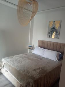 Ένα ή περισσότερα κρεβάτια σε δωμάτιο στο Appartement avec piscine et accès à la plage +46 φωτογραφίες