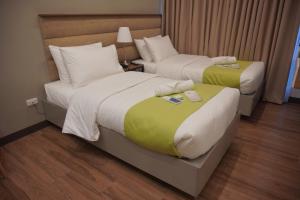 Katil atau katil-katil dalam bilik di Avioré Hotel Tacloban