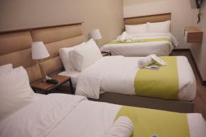 Katil atau katil-katil dalam bilik di Avioré Hotel Tacloban