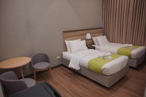 Katil atau katil-katil dalam bilik di Avioré Hotel Tacloban