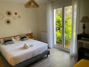 Postel nebo postele na pokoji v ubytování Hotel Aux Tamaris