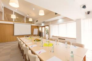 a large conference room with a long table and chairs at Hotel Vega Luhacovice in Luhačovice
