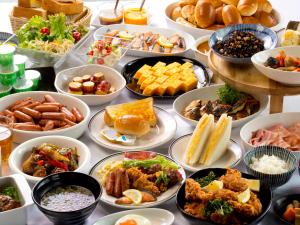 a table topped with lots of different types of food at Hotel Hillarys in Osaka