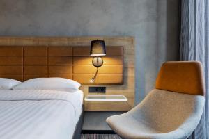 Cama ou camas em um quarto em Moxy Warsaw Praga