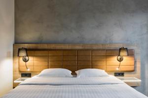 Cama ou camas em um quarto em Moxy Warsaw Praga