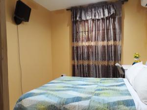 Katil atau katil-katil dalam bilik di Argalo Suites 1