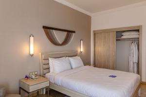 Кровать или кровати в номере Fun & Sun Club Saphire