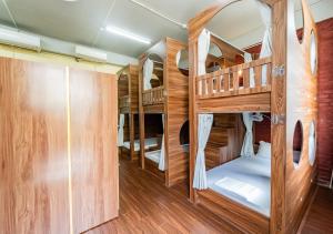 a group of bunk beds in a room at Soleil Hostel in Ha Long