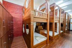 a room with wooden bunk beds at Soleil Hostel in Ha Long