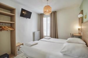 Postel nebo postele na pokoji v ubytování Merryl Hotel + 12 fotografií