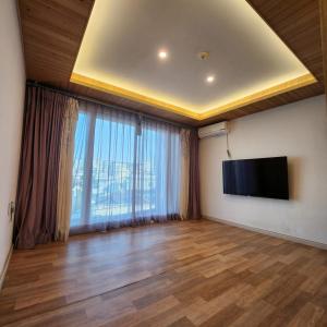TV a/nebo společenská místnost v ubytování Ariene Guesthouse