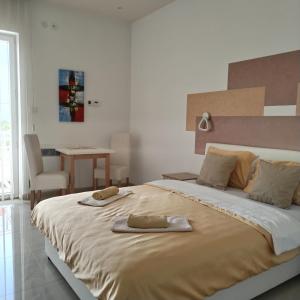 Postel nebo postele na pokoji v ubytování Kristal Apartmani - Banja Ždrelo