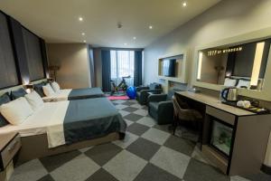 a hotel room with a bed and a desk at Tryp By Wyndham Istanbul Sancaktepe in Istanbul