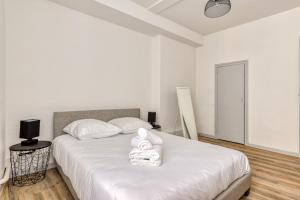 Łóżko lub łóżka w pokoju w obiekcie Ò Grand Carnot/Hyper centre/Proche Gare