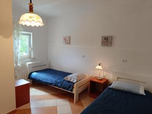Postel nebo postele na pokoji v ubytování Adriana Holiday Apartment