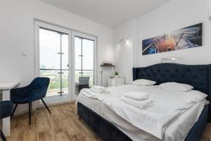 Posteľ alebo postele v izbe v ubytovaní Kasprzaka 29 B-C by Homeprime